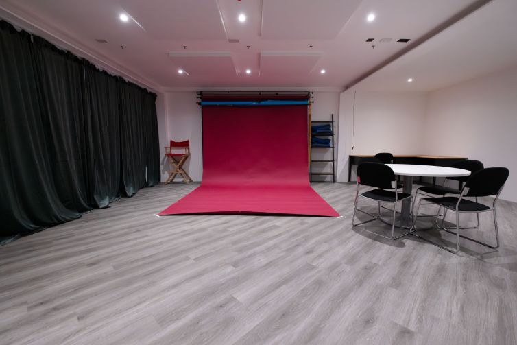 Photo of studio 3 with the crimson colourama rolled out
