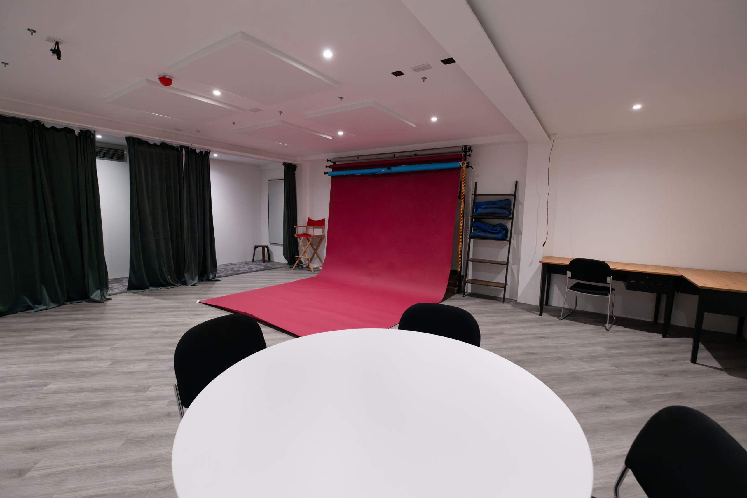 Photo of studio 3 with the crimson colourama rolled out