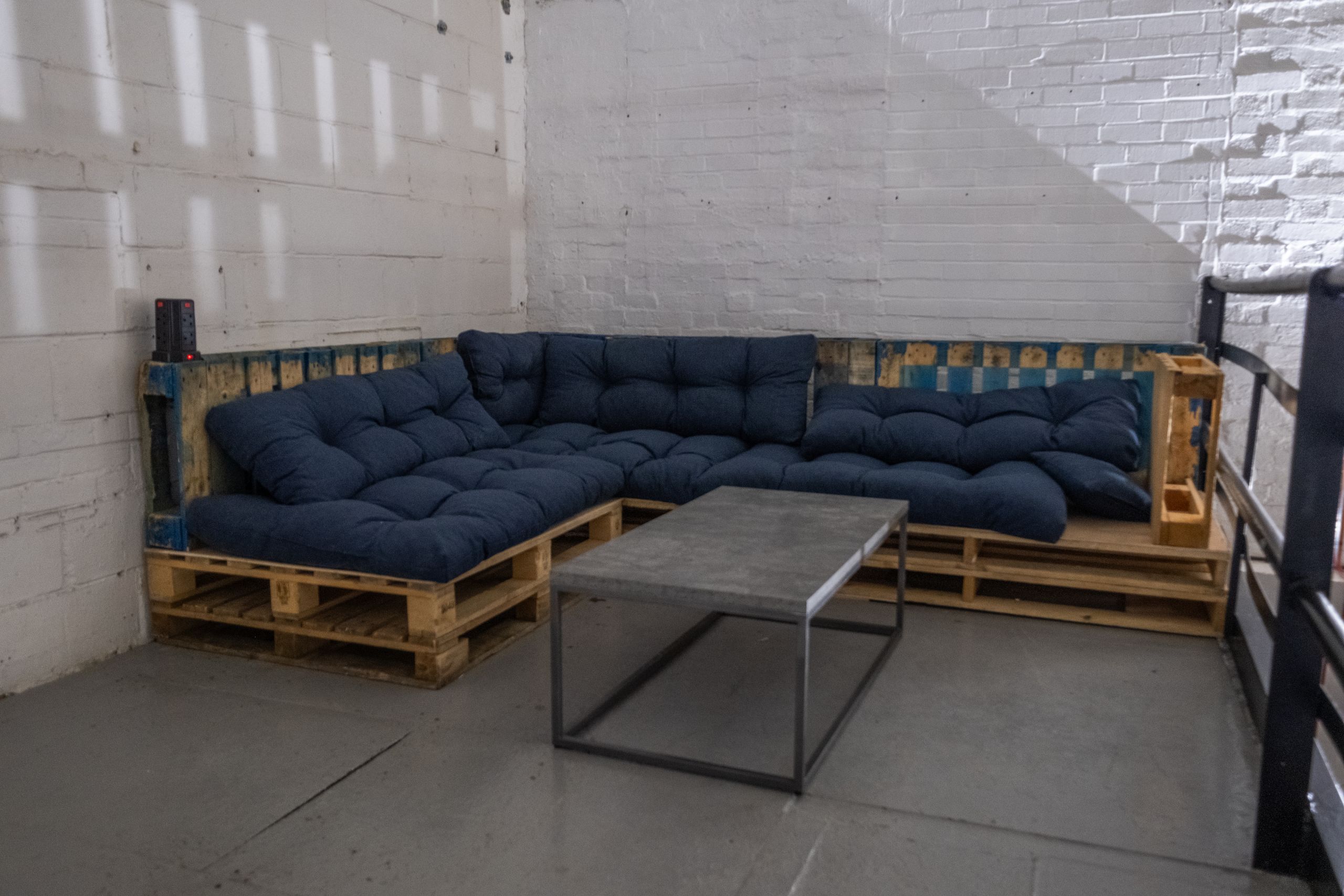 Studio 2 mezzanine with pallet sofa